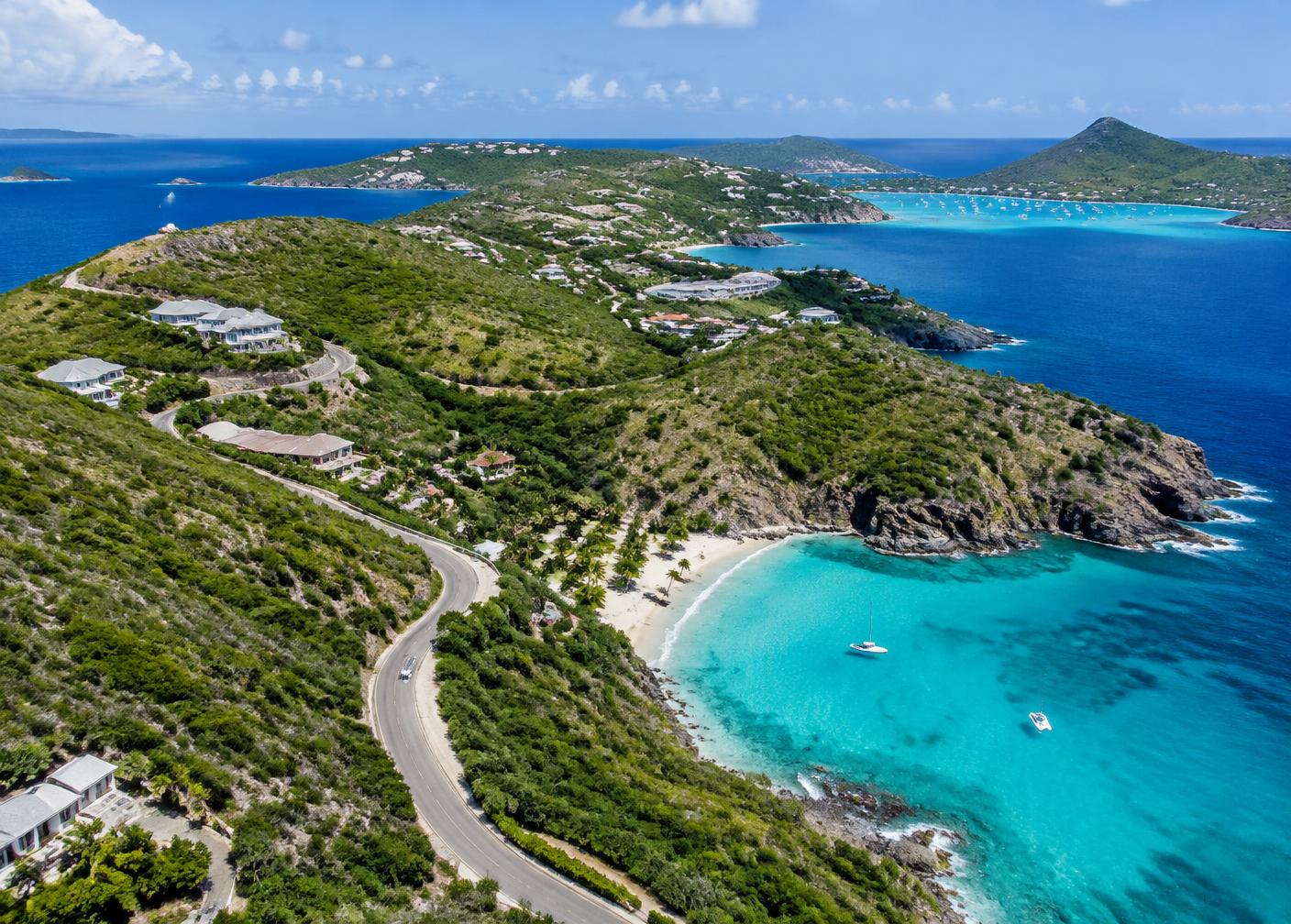Coastal road winding above a turquoise bay in Saint Barthélemy